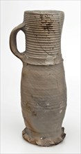 Gray stoneware jug be frowned orange flamed, jug be found on the floor ceramic stoneware, hand-turned baked coarse slightly