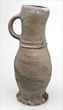 Gray stoneware jug on pinched foot, jug be found at the bottom of the ceramic stoneware, hand-turned baked Stoneware jug flat