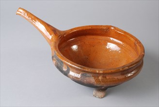 Pottery saucepan on three legs, with pouring spout and slant directed upwards, saucepan cooking pot crockery holder kitchenware