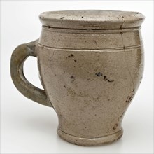Stoneware jar with ear on narrow foot, drinking cup drinking utensils holder soil find ceramic stoneware glaze salt glaze, hand