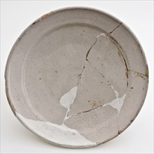White faience plate on stand, plate crockery holder soil find ceramic earthenware glaze tinglaze, hand-turned baked glazed fried