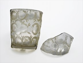Two fragments of glass cup or drinking glass, conical, sharpened and decorated with radgraving, mug drinking glass drinking