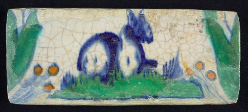 Border tile, blue, yellow and green, lying animal, hare?, edge tile wall tile tile sculpture ceramics pottery glaze, baked 2x