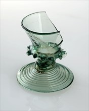 Fragment green (toy?) Chalice glass with drop edge under the center of the glass, drinking glass drinking utensils tableware