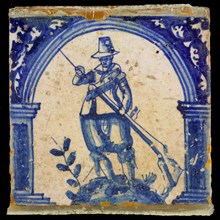 Figure tile, in blue on white, warrior with gun, wall tile tile sculpture ceramic earthenware glaze, baked 2x glazed painted