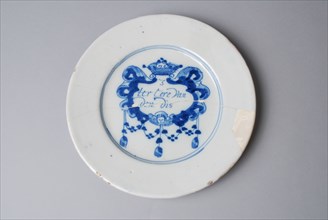 Faience plate on stand surface, with spell in modified cartouche in blue on white ground, plate dish crockery holder soil find