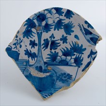 Fragment majolica plate on stand, decorated with flowers in vase, in blue on white ground, plate dish crockery holder soil find