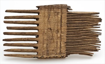 Fragment wooden comb with wheel trim, comb soil finds wood, sawn cut Fragment of wooden comb with coarse and fine teeth.