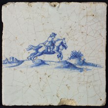 White tile with blue rider in landscape with houses, fence and bushes, wall tile tile sculpture ceramic earthenware glaze, baked
