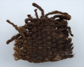 Fragment of woolen fabric or clothing, colored brown, blanket soil find wool, w 7.0 washed spun woven textile Fragment of woolen
