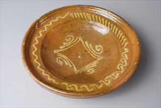Pottery dish on stand ring, yellow silt decoration in mirror and on the flag, dish crockery holder soil find ceramic earthenware