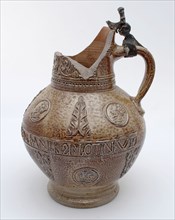 Stoneware jug be surrounded by belly frieze with text, portrait medallions and acanthus leaves, jug crockery holder soil find