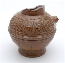Brown stoneware jug be carved with decorative carvings and embossing with floral decoration, jug crockery holder soil find