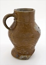 Light brown stoneware drinkan, with pinched foot, pot jug crockery holder soil find ceramic stoneware clay engobe glaze salt