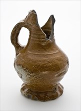 Small brown stoneware jug with pinched foot, jug crockery holder soil find ceramic stoneware clay engobe glaze salt glaze