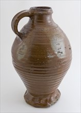 Dark brown stoneware jug with three feet with radial stamping, water jug jug holder kitchenware floorfound ceramics stoneware