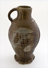 Brown stoneware jug be decorated with three lines on the edge of the mouth and on the shoulder, jug crockery holder soil find