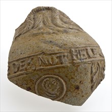 Light brown fragment of Bartmann jug, also called Bellarmine jug, frieze with text, Bartmann jugtableware holder fragment earth