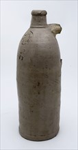Stoneware mineral water bottle on stand surface, cylindrical model, gray and marked, mineral pitcher pitcher pitcher product
