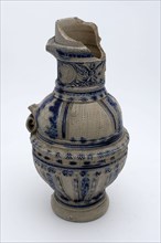 Stoneware jug with kerf-cut decor on shoulder, round neck band with three medallions in which mask, jug crockery holder soil