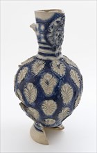 Stoneware jug be covered with mask under shawl, belly completely covered with flower appliqués on blue ground, jug crockery