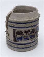 Stoneware mug with stylized floral band around belly, blue piping, purple and blue glaze, pulp drinking utensils tableware