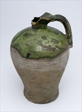 Partially green glazed gray jug with ear, narrow and protruding neck, jug holder kitchen utensils earthenware ceramics