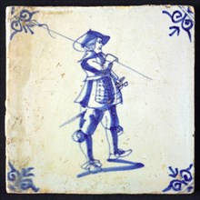 White tile with blue warrior; corner pattern ox head, wall tile tile sculpture ceramic earthenware glaze, baked 2x glazed