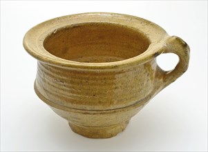 Small pottery chamber pot on stand, white shard and yellow glaze, pot holder sanitary earthenware ceramics earthenware glaze
