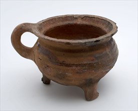 Pottery cooking jug, grape-model, red shard, sparingly glazed, shank, sausage ear, on three legs, cooking pot crockery holder