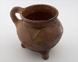 Pottery cooking jug, grape-model, red shard, sparingly glazed, sausage ear, on three legs, cooking jug