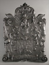 Fireback with crowned coat of arms, centaur and ribbon with date 1647, fire place, cast Rectangular with volutes on the corners