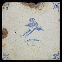 White tile with blue flying putto with laurel wreath, ox-head in the corners, wall tile tile sculpture ceramic earthenware glaze