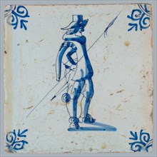 White tile with blue warrior with spear; corner pattern ox head, two shades of blue, wall tile tile sculpture ceramic
