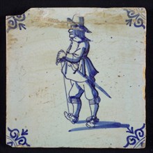 White tile with blue warrior with sword, stick and hat; corner pattern ox head, wall tile tile sculpture ceramic earthenware