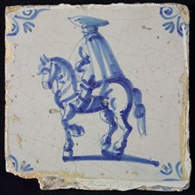 White tile with blue rider with cape and hat; corner pattern ox head, wall tile tile sculpture ceramic earthenware glaze, baked