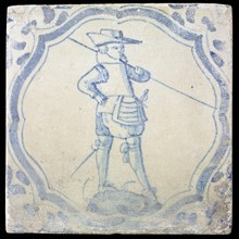 White tile with blue warrior in accolade-shaped frame, corner motif wing leaf, wall tile tile sculpture ceramic earthenware