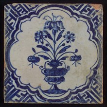 White tile with blue pot with flowers in braid-shaped frame, corner pattern meander, wall tile tile sculpture ceramic