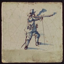 Tile, blue and purple on white, shooting musketeer, wall tile tile sculpture ceramic earthenware glaze, baked 2x glazed painted
