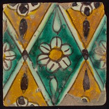 Floor tile, brown draft, green and yellow on white ground, central green oblique glass in which white flower with yellow heart