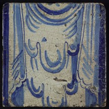 Tile of chimney pilaster, blue on white, upper part of shell-like headdress and two curly floral ornaments, chimney pilaster