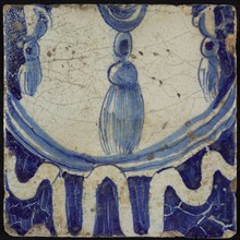 Tile of chimney pilaster, blue on white, bottom of pleated lap with three hanging tassels underneath and garland edge, chimney