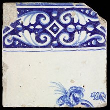 Tile, in blue on white, above ornament edge, underneath part of the head of soldier with helmet and plume, tile picture footage