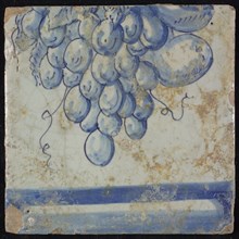 Tile of chimney pilaster, blue on white, part of upwards continuous representation with fruits, including grapes, underneath