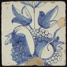 Tile of chimney pilaster, blue on white, part of up and down continuous representation with fruits and branches, chimney