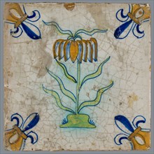 Tile, flower on ground in orange, yellow, brown, green and blue on white, corner pattern french lily, corner point yellow, wall
