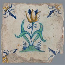 Tile, flower on ground in orange, brown, yellow, green and blue on white, corner pattern french lily, corner point yellow, wall