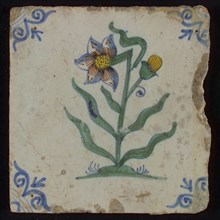 Tile, flower on spot in yellow, brown, green and blue on white, corner motif oxen head, wall tile tile sculpture ceramic