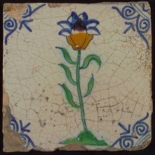 Tile, flower on ground in orange, purple, green and blue on white, corner motif oxen head, wall tile tile sculpture ceramic