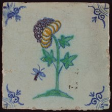 Tile, flower on plot with flying insect in orange, purple, green and blue on white, corner pattern ox-head, wall tile